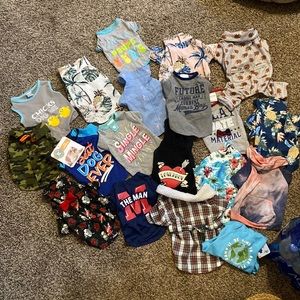 Lot of 19 dog outfits (size small)